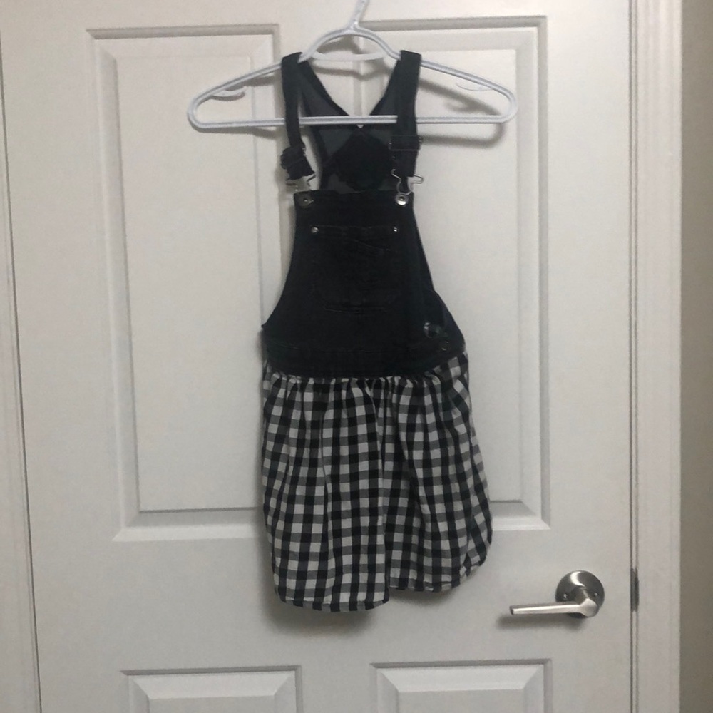 Girls black and white overalls.